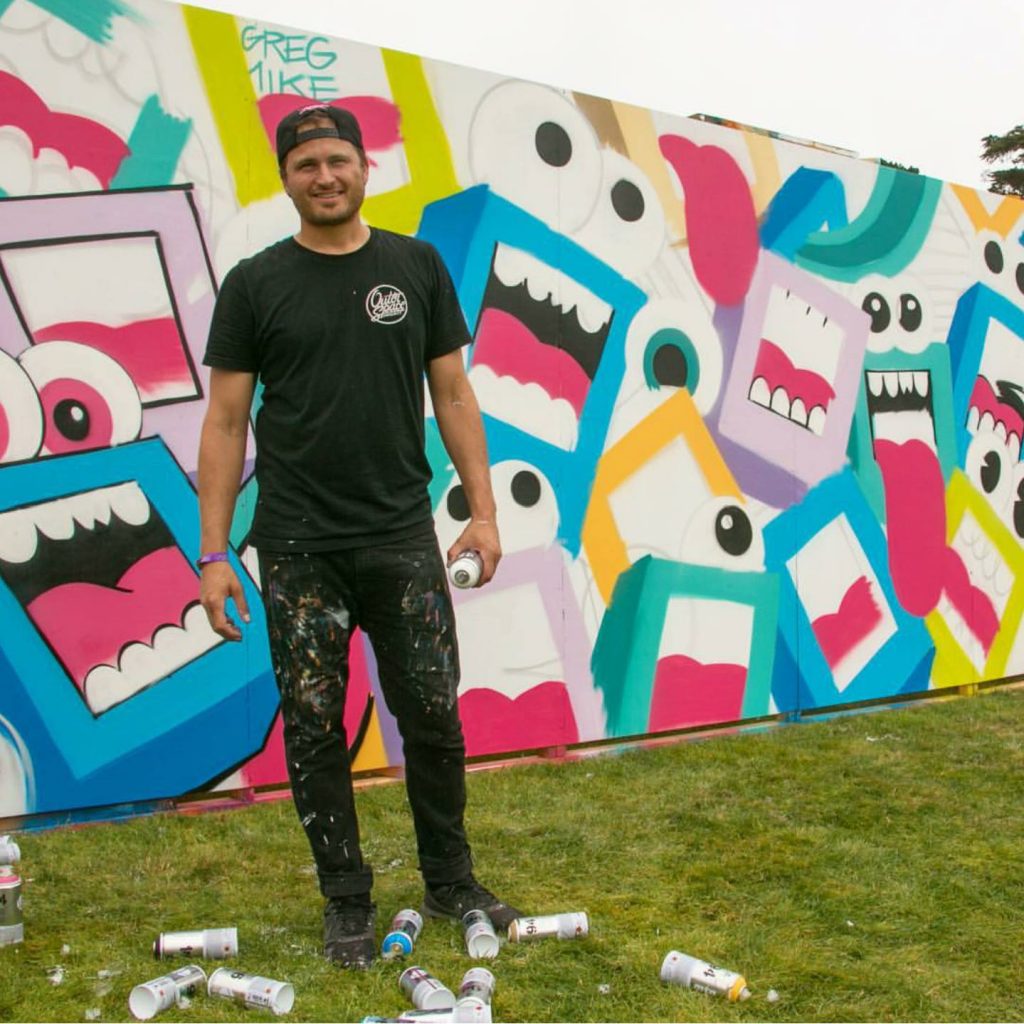 Artist Greg Mike by his work at last year's Outside Lands. Image c/o Instagram user @rangerdave.