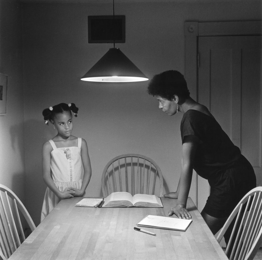 A woman faces her daughter in Carrie Mae Weems' Untitled (Woman with Daughter), . Image c/o Art Docent Program.